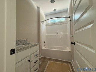 14502 Gatewood Road Dewitt, VA 23840 - Photo 17 of 32 a bathroom with a tub and shower