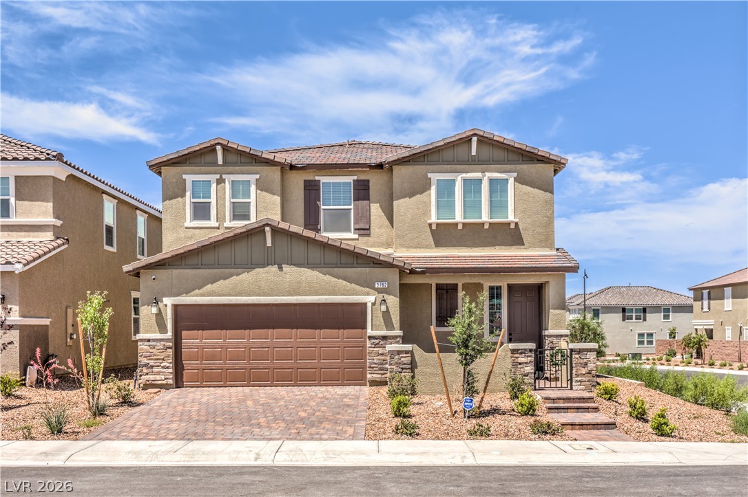 3782 Alla Rocca Avenue Henderson, NV 89044 - Photo 1 of 55 This charming residence showcases a two-story design with an attached garage and inviting entrance.