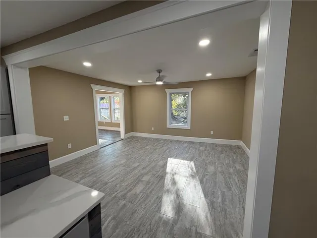 a view of livingroom with hardwood floor and front door