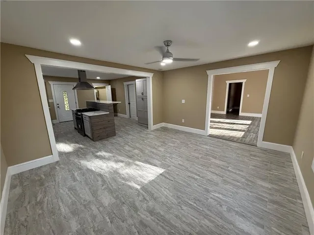 a view of a livingroom with furniture wooden floor and window