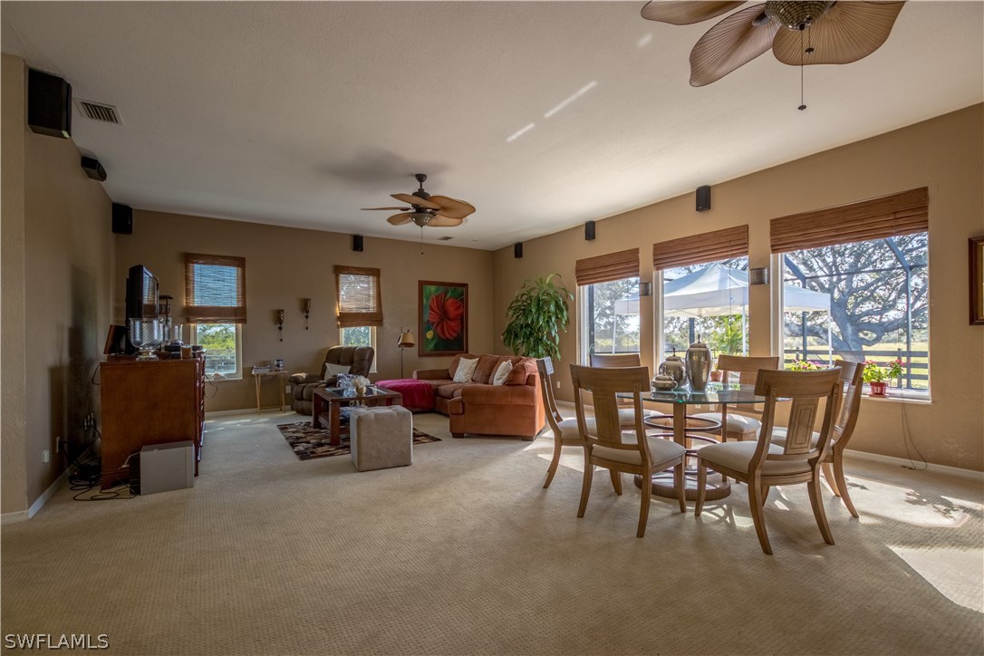 38830 Washington Loop Road Punta Gorda, FL 33982 - Photo 11 of 25 a view of a dining room with furniture window and outside view