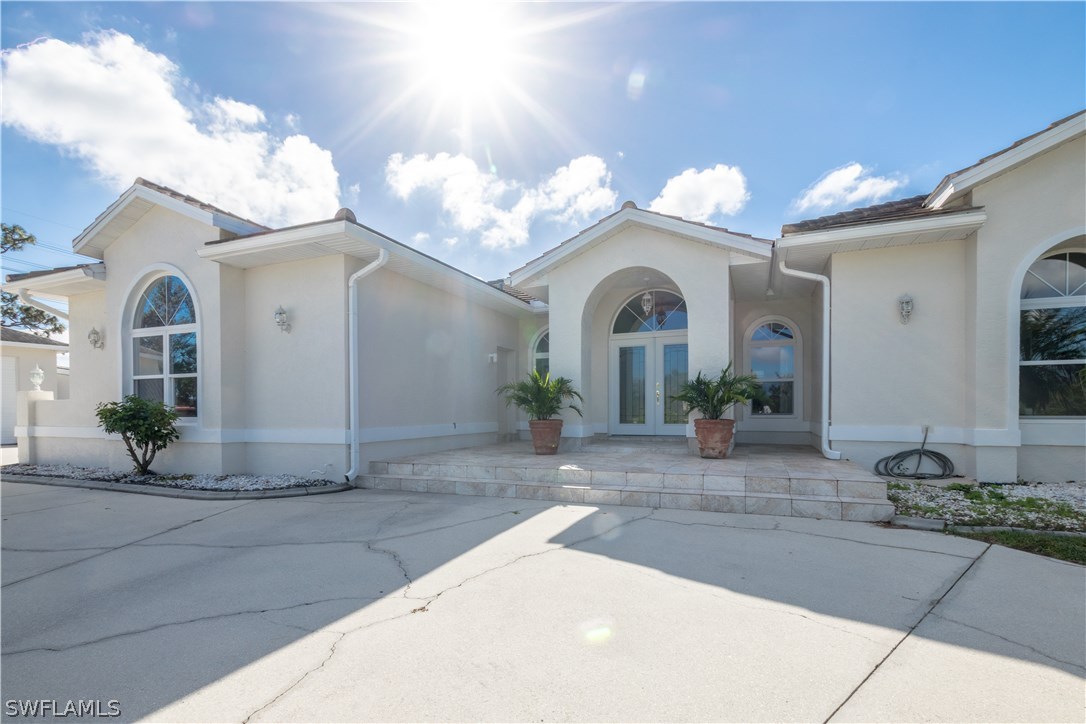 38830 Washington Loop Road Punta Gorda, FL 33982 - Photo 2 of 25 a view of a house with potted plants