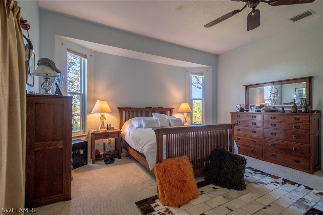 38830 Washington Loop Road Punta Gorda, FL 33982 - Photo 21 of 25 a bed room with a bed window and a dresser