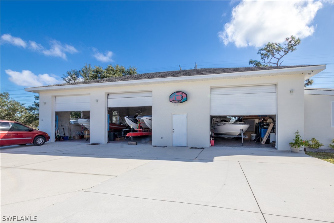 38830 Washington Loop Road Punta Gorda, FL 33982 - Photo 23 of 25 a view of a car garage