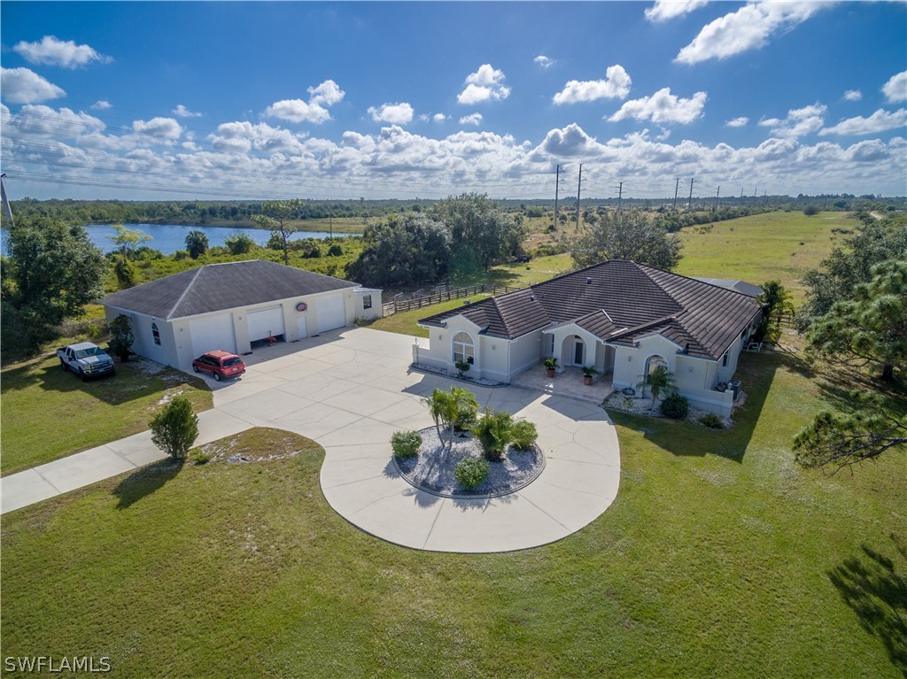 38830 Washington Loop Road Punta Gorda, FL 33982 - Photo 3 of 25 a view of a swimming pool with a yard