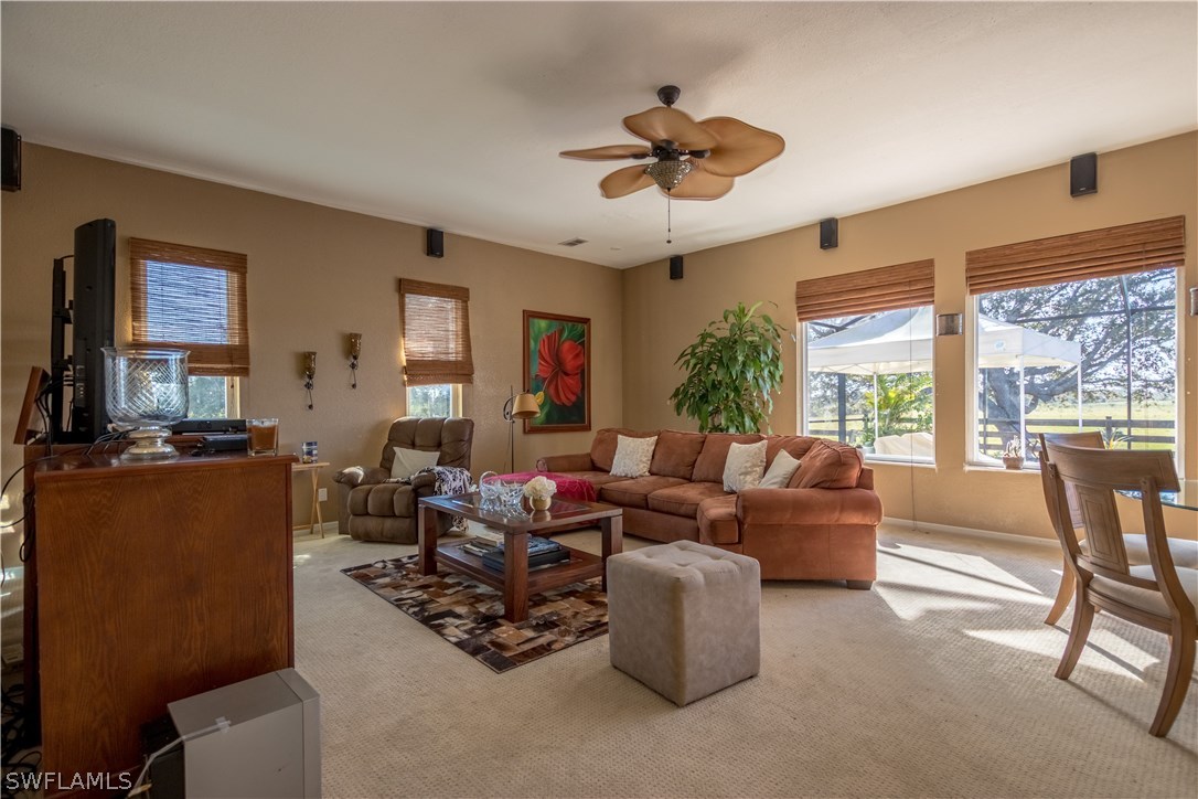 38830 Washington Loop Road Punta Gorda, FL 33982 - Photo 8 of 25 a living room with furniture and a large window