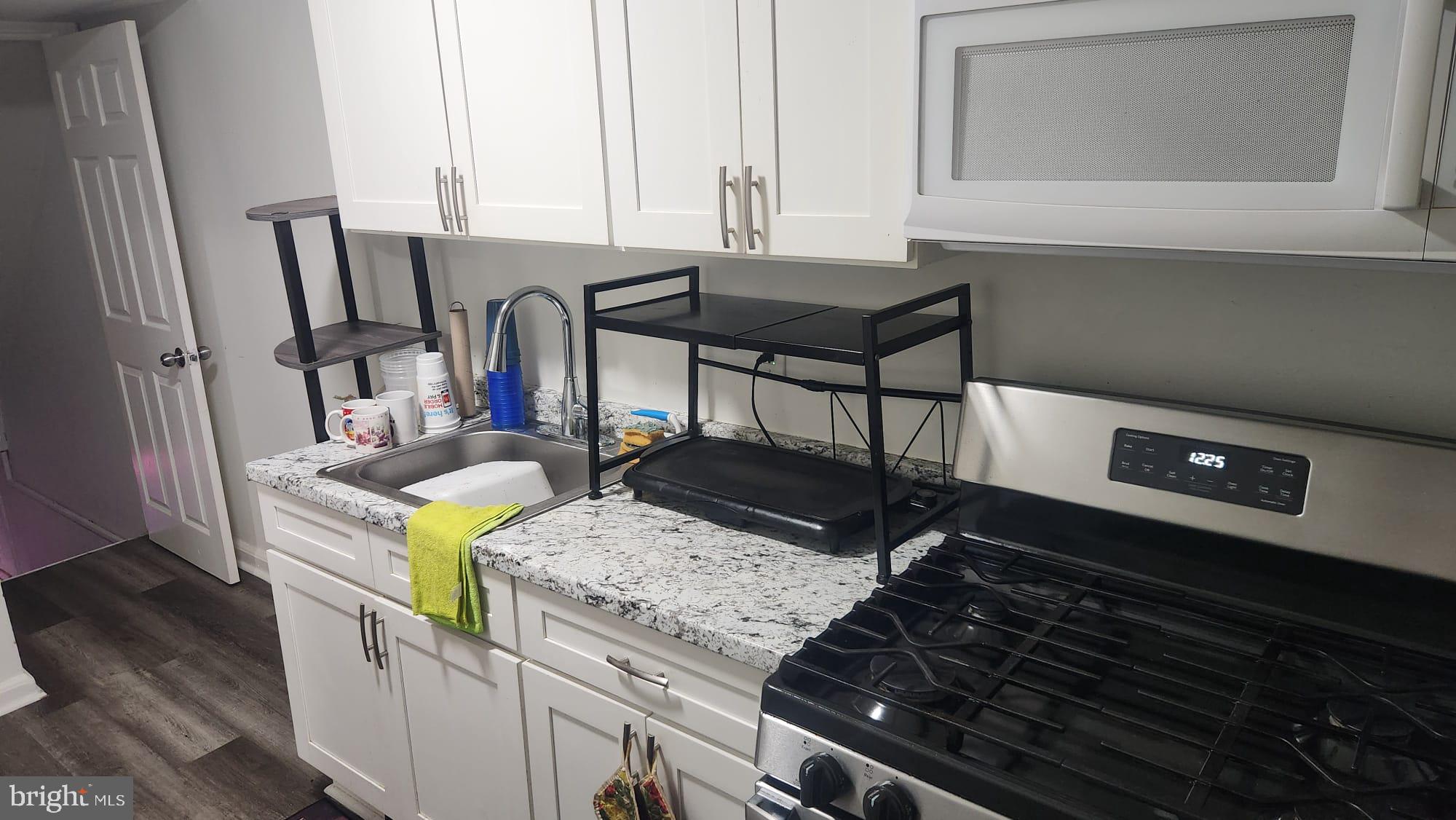 4432 Manorview Road Baltimore, MD 21229 - Photo 16 of 24 Modern kitchen with sleek finishes.