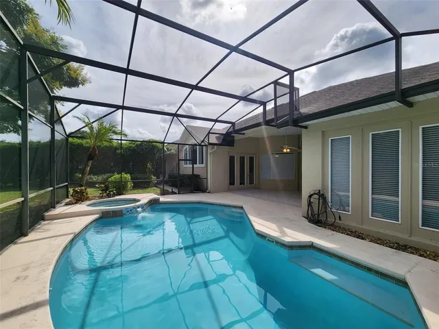 a view of a swimming pool with a patio