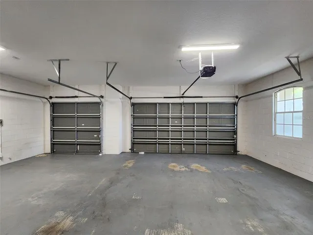 a view of an empty room with a ceiling fan