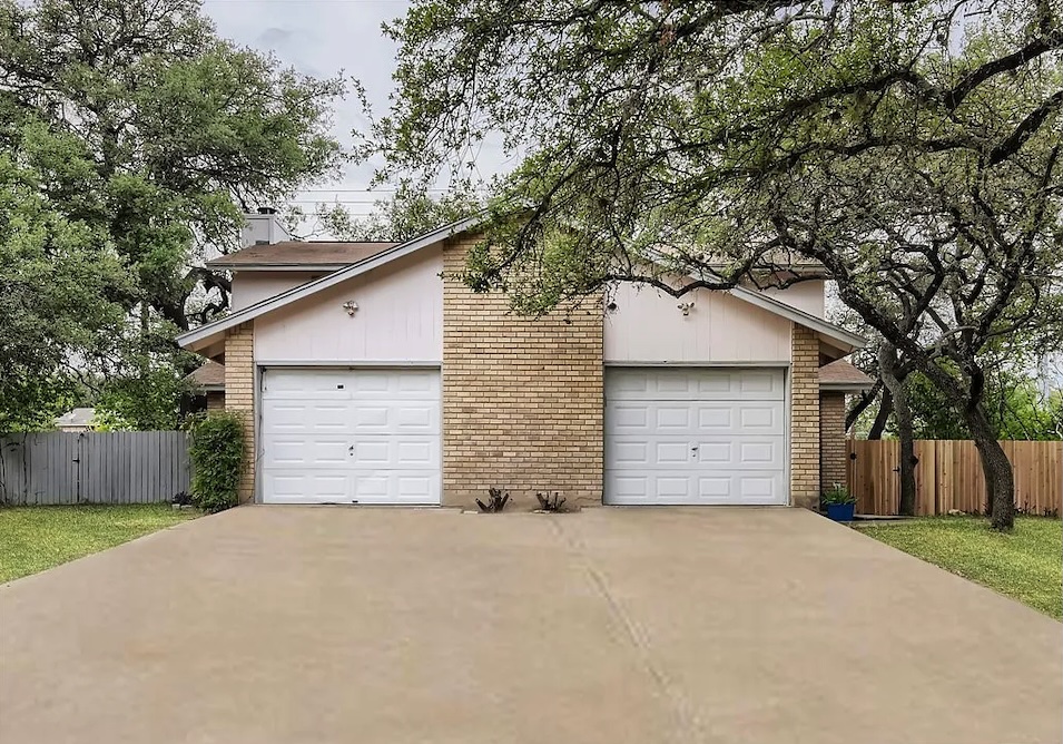 9026 Sawtooth Lane, Unit A Austin, TX 78729 - Photo 9 of 10 a front view of house with garage