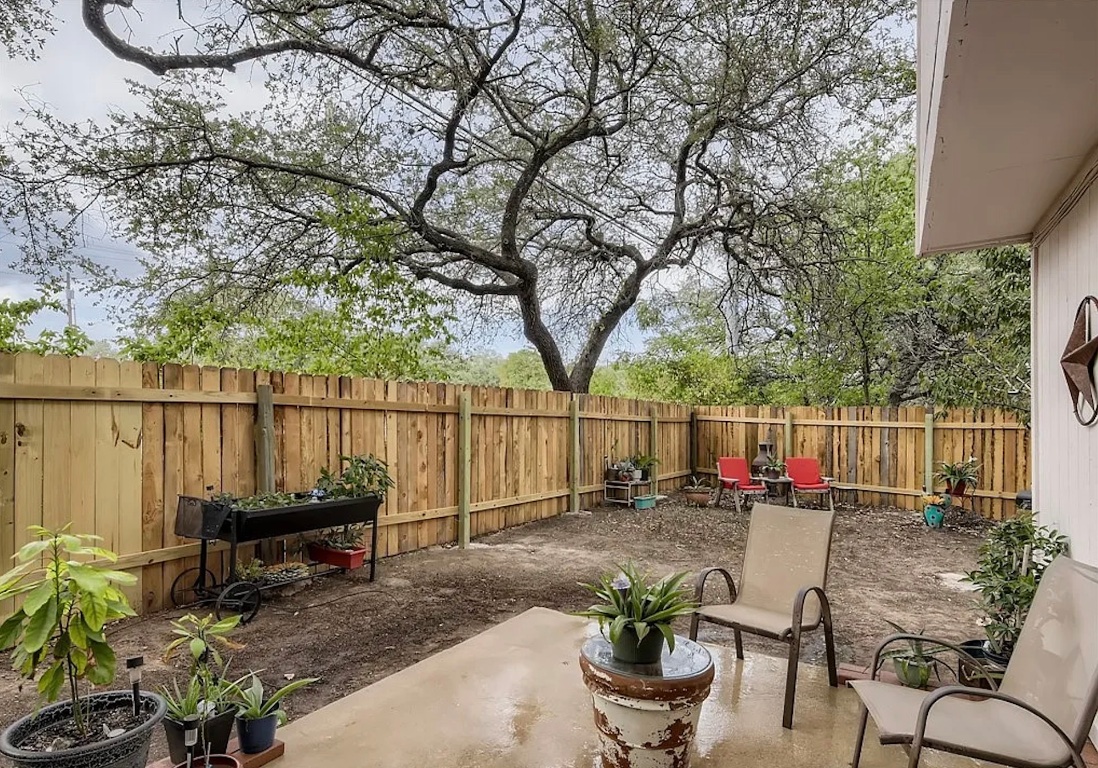 9026 Sawtooth Lane, Unit A Austin, TX 78729 - Photo 10 of 10 a view of a backyard with sitting area