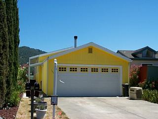 105 Bryce Canyon Road, Unit 105 San Rafael, CA 94903 - Photo 1 of 1 a front view of a house with a yard