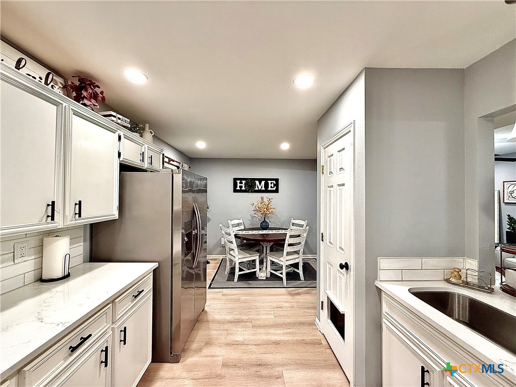 213 Sparrow Lane Victoria, TX 77905 - Photo 15 of 44 a kitchen with a sink appliances and cabinets