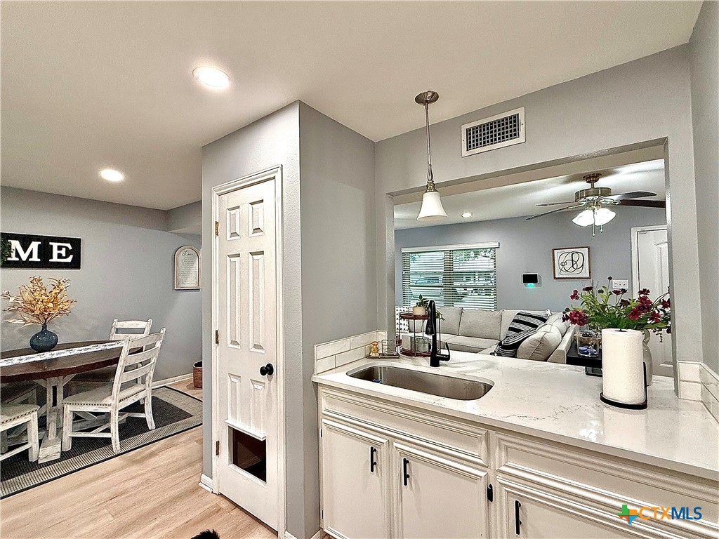 213 Sparrow Lane Victoria, TX 77905 - Photo 18 of 44 a view of a kitchen with a sink and breakfast area