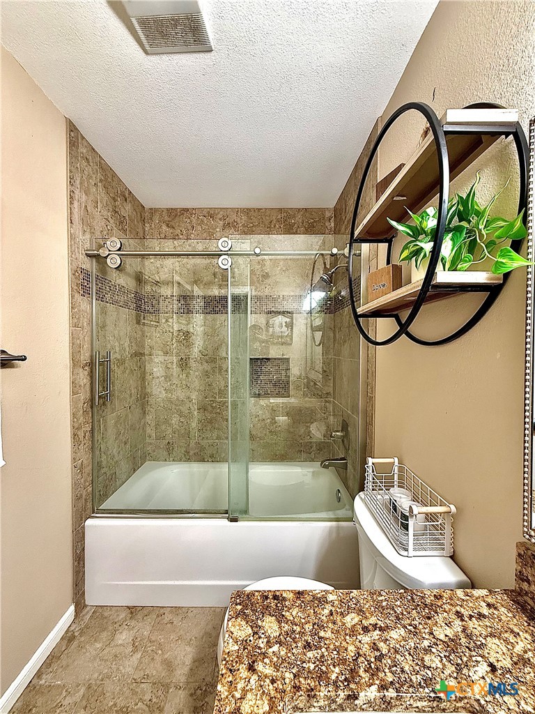 213 Sparrow Lane Victoria, TX 77905 - Photo 36 of 44 a bathroom with a bathtub and a shower