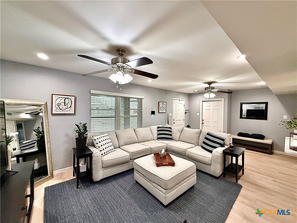 213 Sparrow Lane Victoria, TX 77905 - Photo 4 of 44 a living room with furniture and a wooden floor