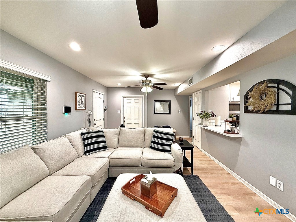 213 Sparrow Lane Victoria, TX 77905 - Photo 5 of 44 a living room with furniture and wooden floor