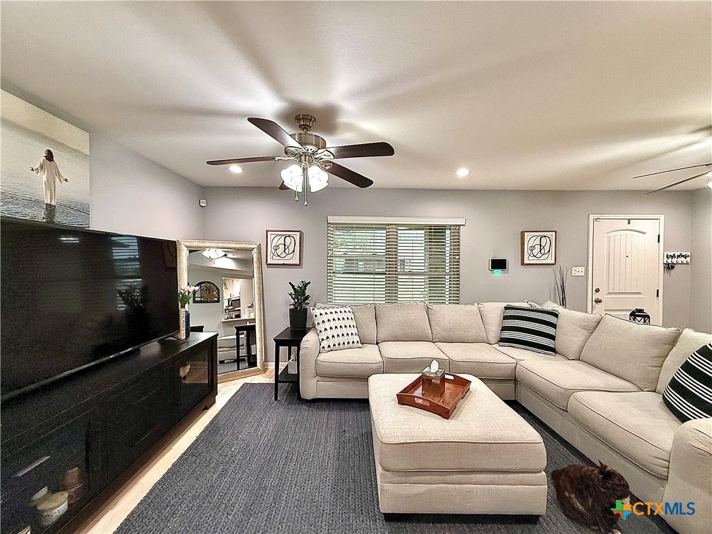 213 Sparrow Lane Victoria, TX 77905 - Photo 6 of 44 a living room with furniture and a flat screen tv