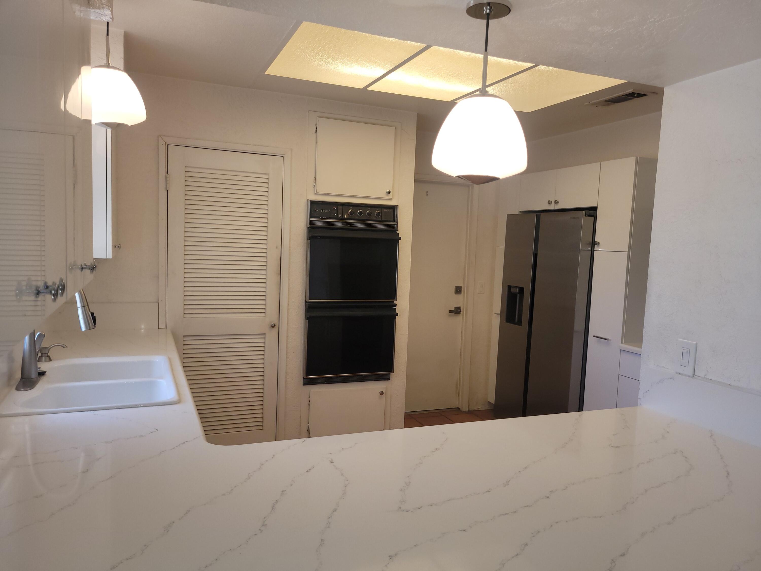 70380 Chappel Road Rancho Mirage, CA 92270 - Photo 11 of 30 a bathroom with a sink and a mirror