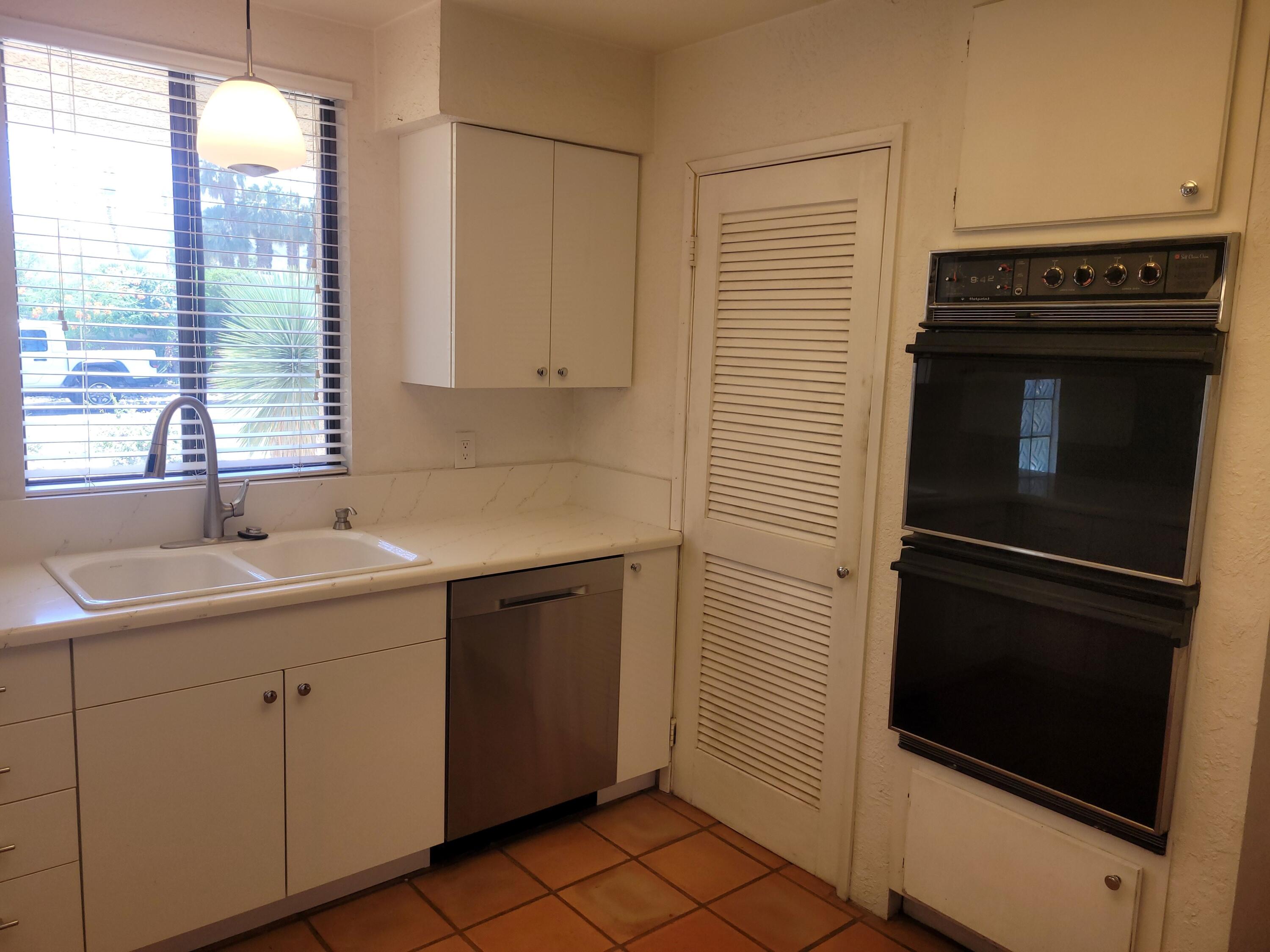 70380 Chappel Road Rancho Mirage, CA 92270 - Photo 15 of 30 a kitchen with a sink and cabinets