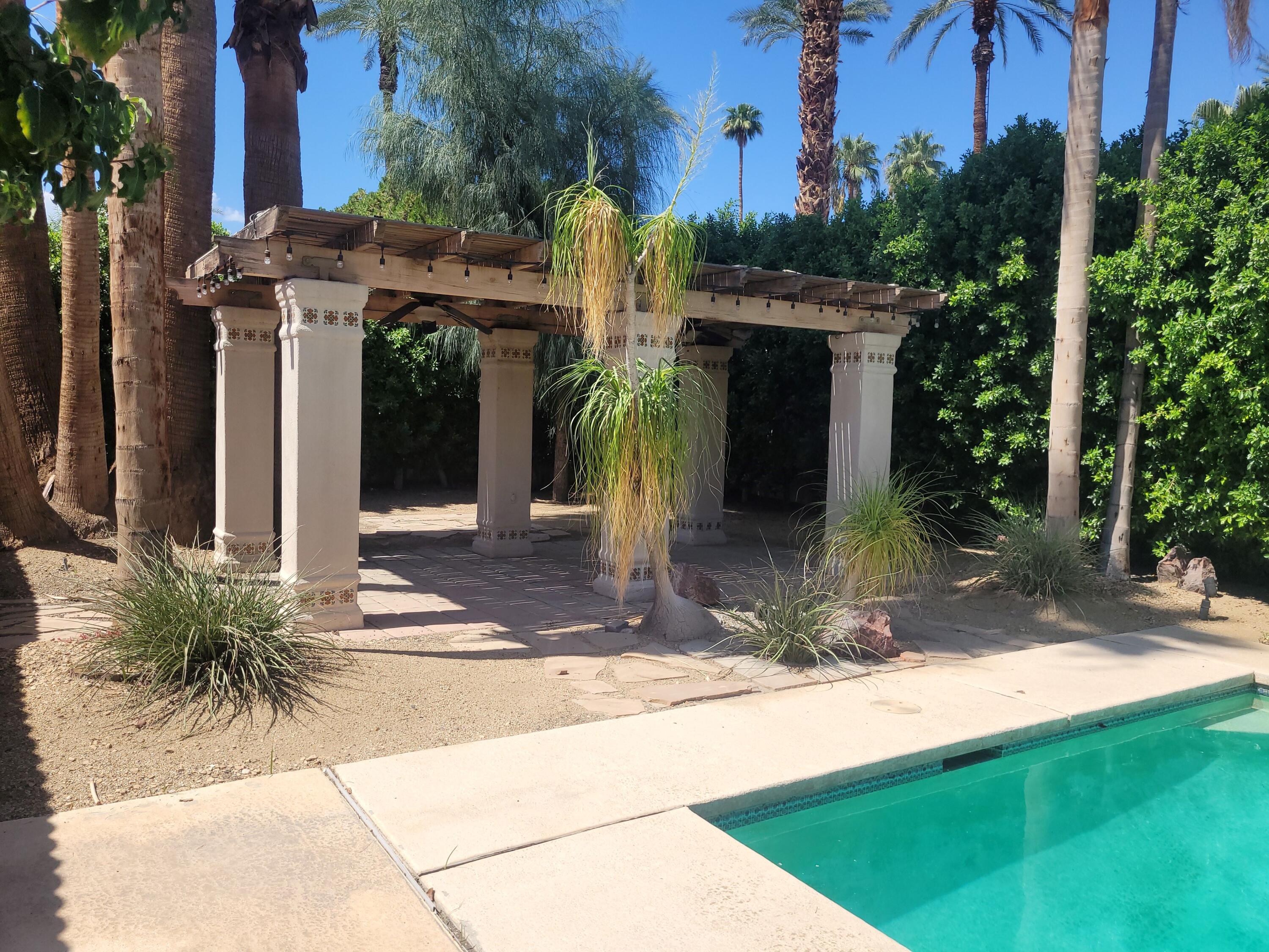 70380 Chappel Road Rancho Mirage, CA 92270 - Photo 2 of 30 a front view of a house with garden