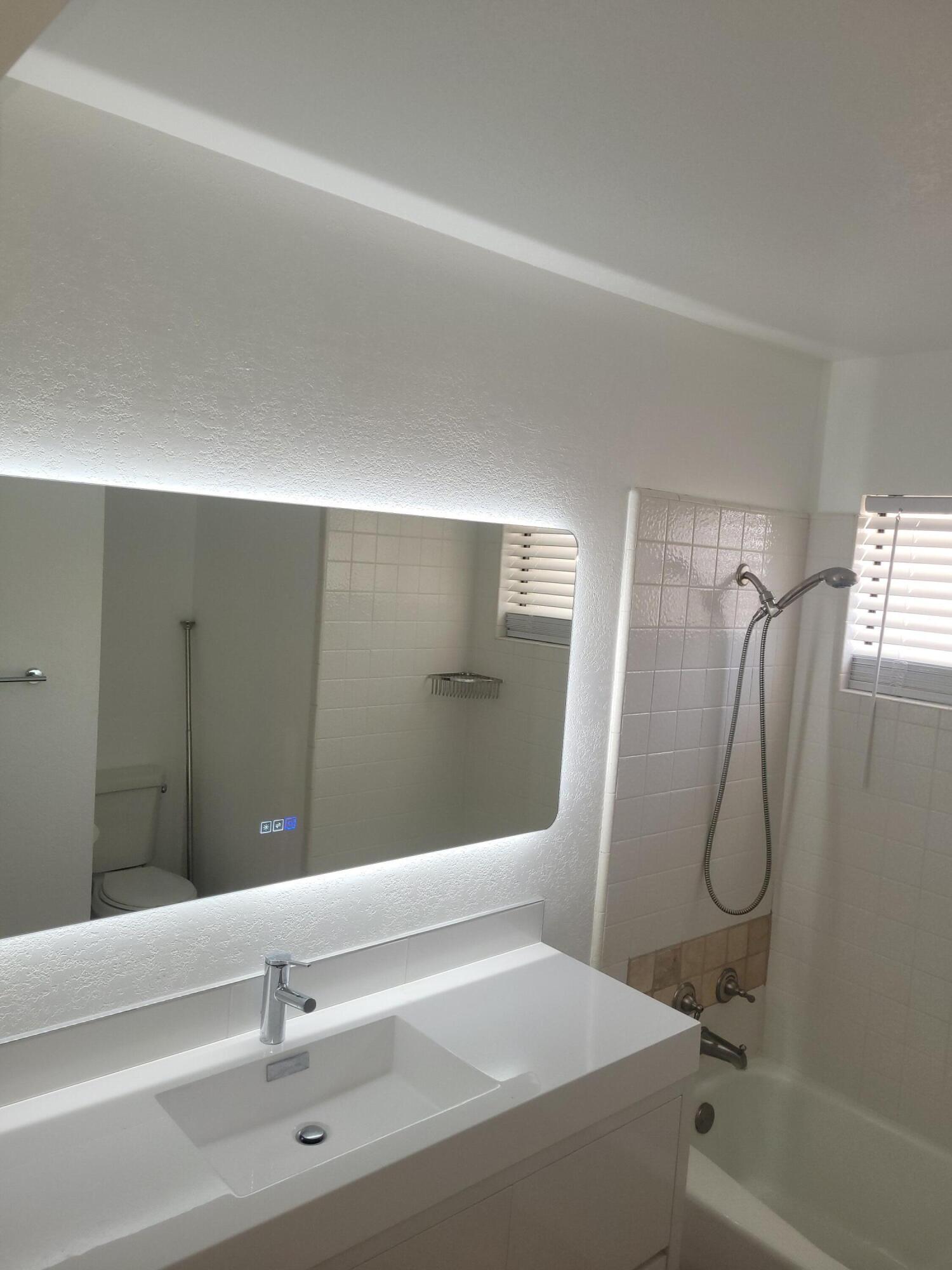 70380 Chappel Road Rancho Mirage, CA 92270 - Photo 24 of 30 a bathroom with a sink and a mirror