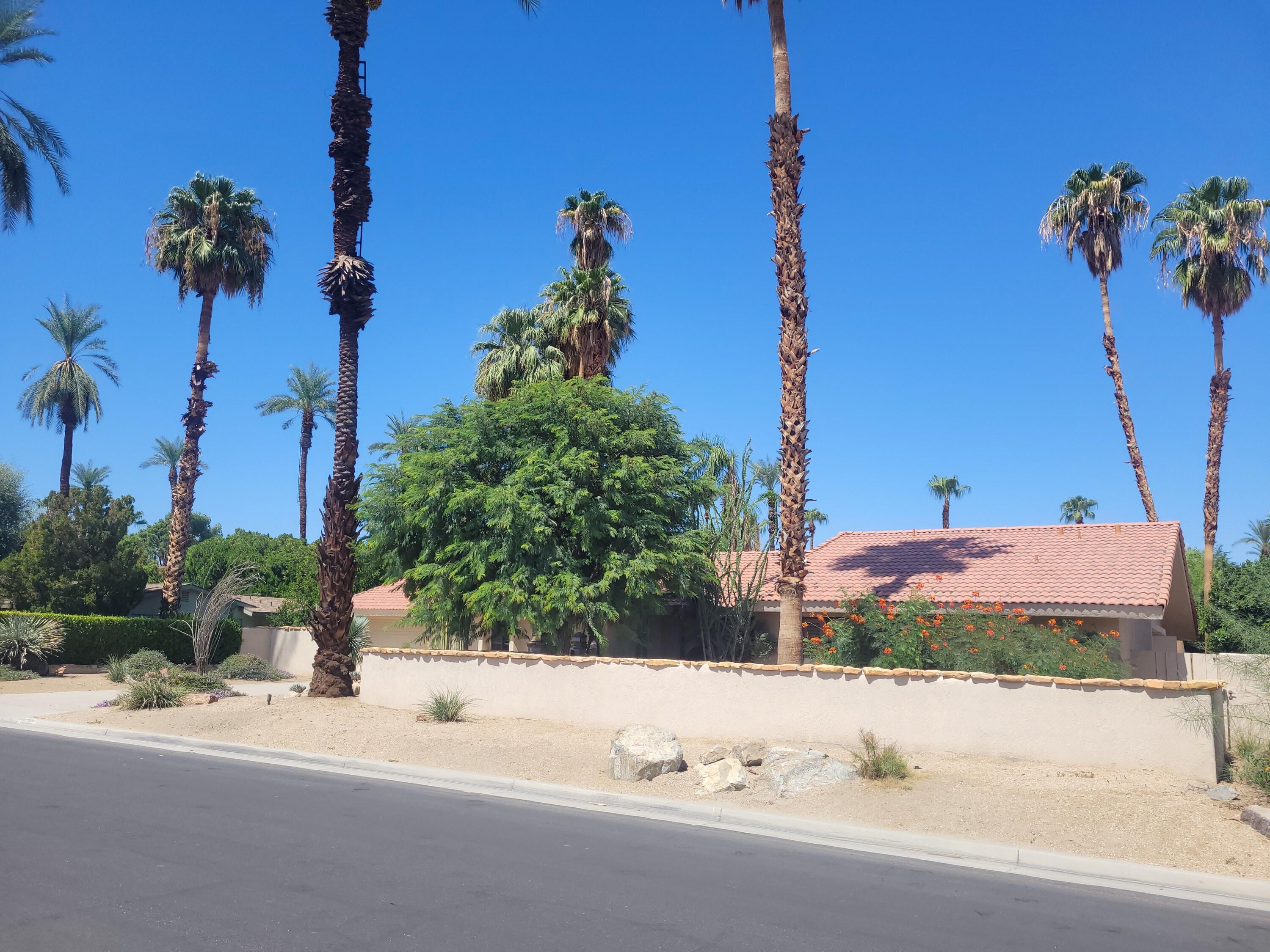 70380 Chappel Road Rancho Mirage, CA 92270 - Photo 7 of 30 a front view of a house with a yard and a car park