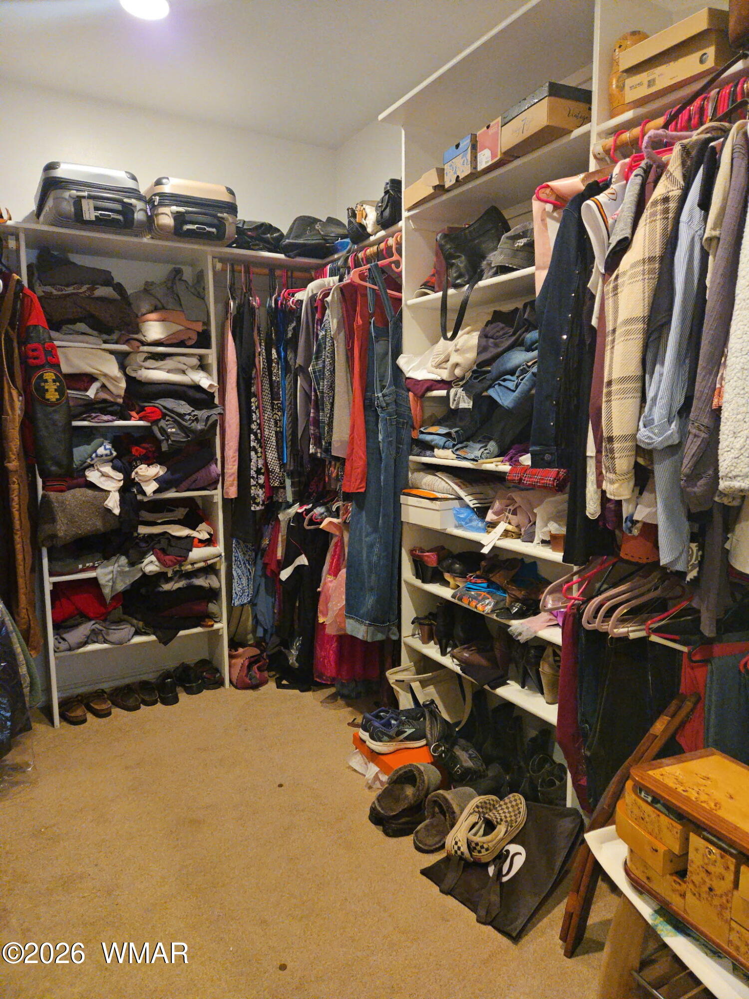 1940 Stonegate Way Heber, AZ 85928 - Photo 28 of 62 a view of walk in closet with clothes and shoes