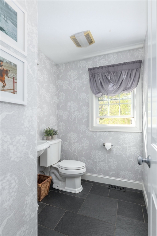 27 Vista Circle Rutland, MA 01543 - Photo 13 of 35 a bathroom with a toilet a sink and mirror