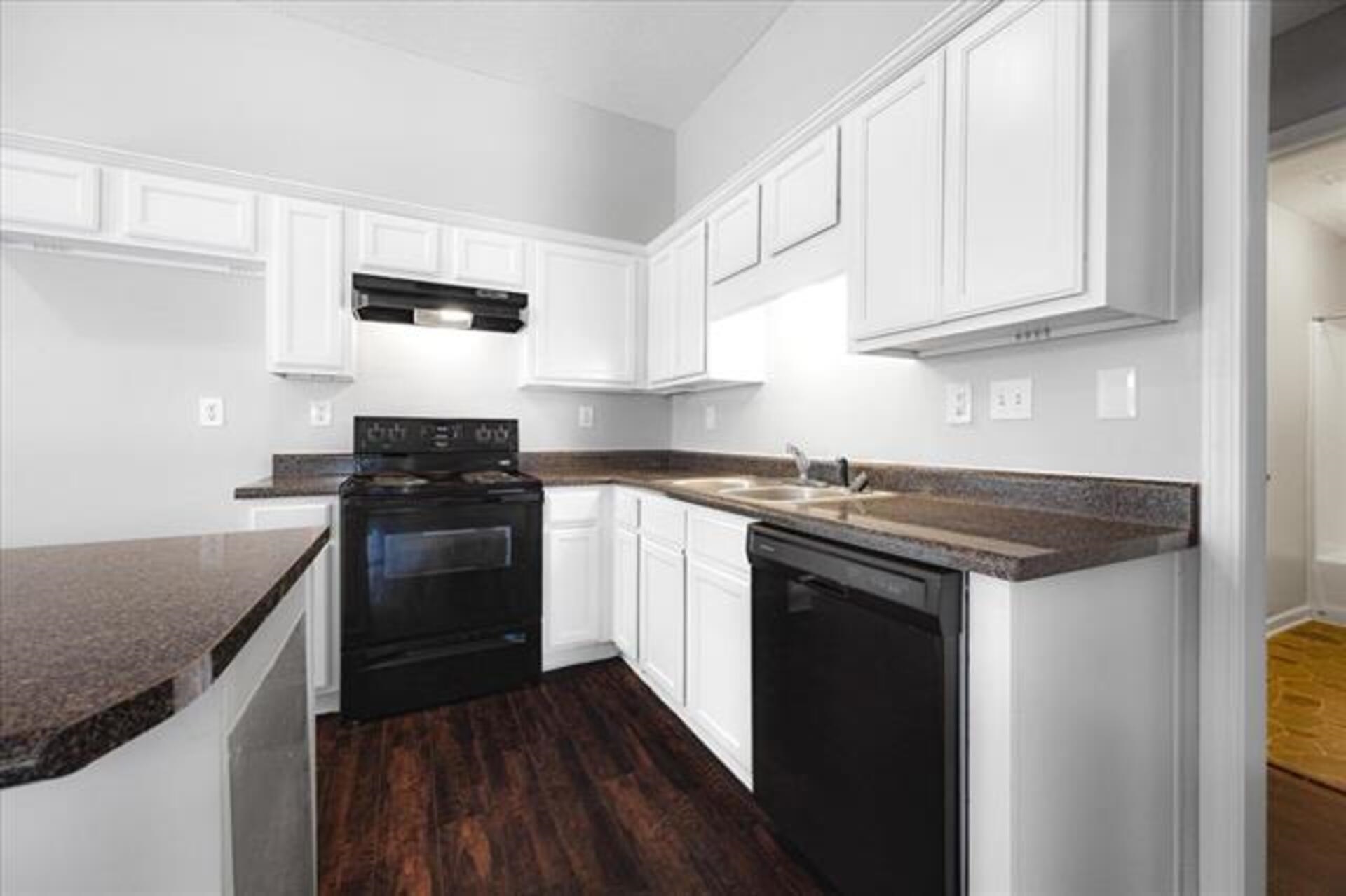 5569 Falling Bark Drive Memphis, TN 38134 - Photo 12 of 31 a kitchen with stainless steel appliances granite countertop a stove and a sink