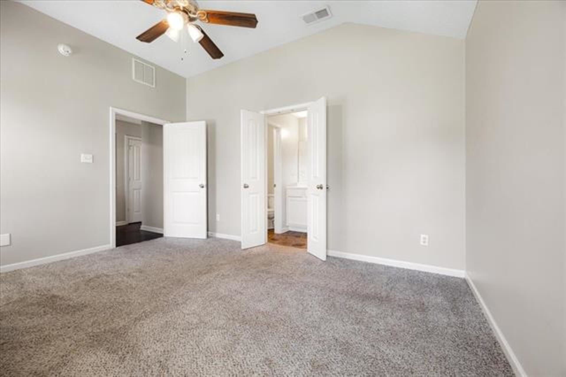 5569 Falling Bark Drive Memphis, TN 38134 - Photo 21 of 31 an empty room with chandelier fan