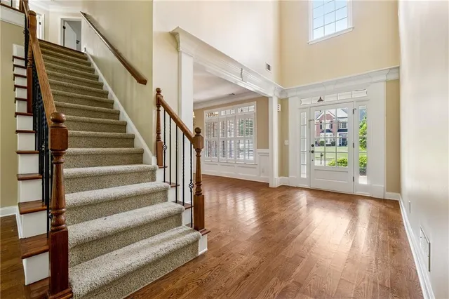 a view of an entryway with wooden floor