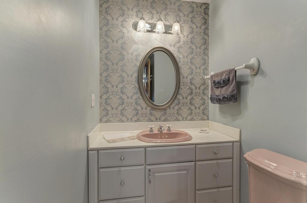 457 Fall Circle Roselle, IL 60172 - Photo 25 of 37 a bathroom with a sink and a mirror