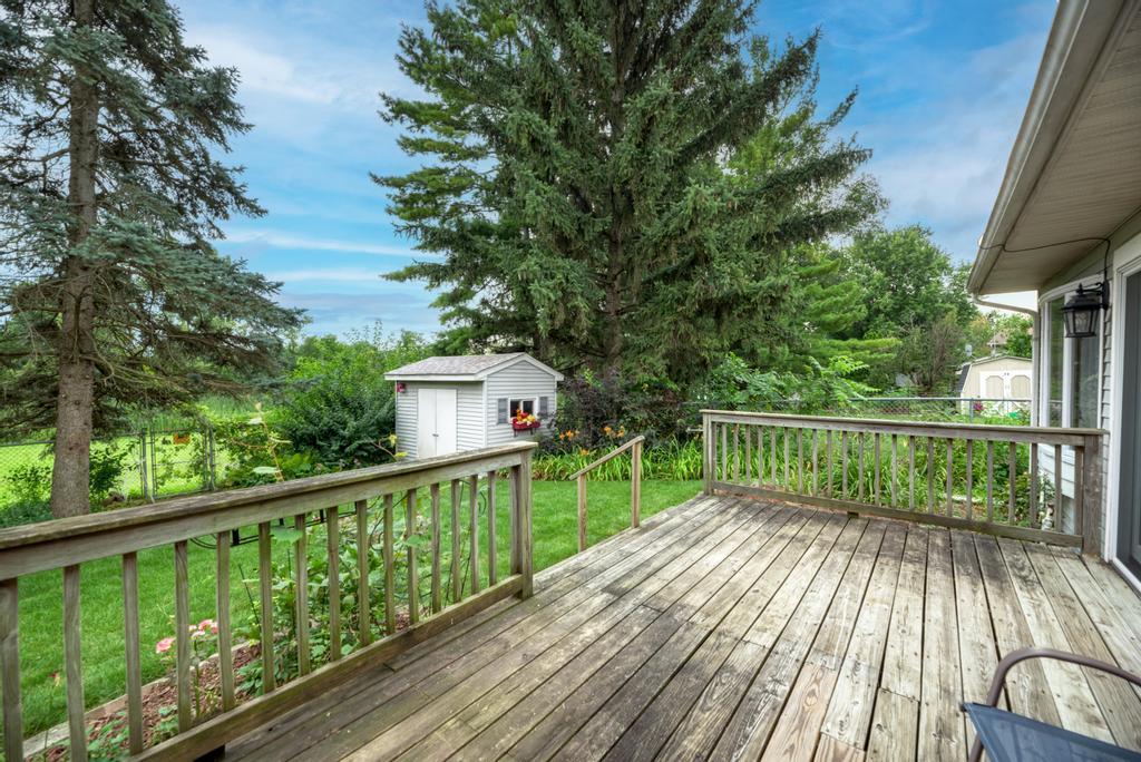 457 Fall Circle Roselle, IL 60172 - Photo 33 of 37 a view of balcony with wooden floor and fence