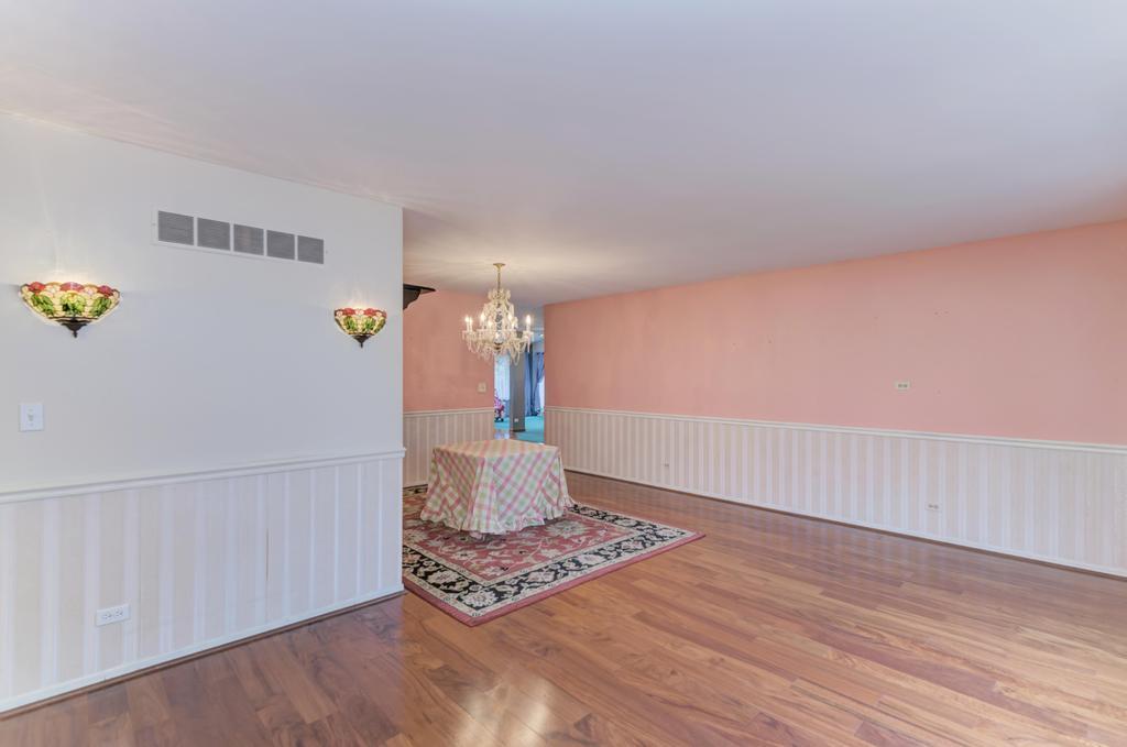 457 Fall Circle Roselle, IL 60172 - Photo 6 of 37 a view of an empty room and wooden floor