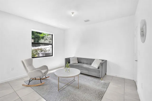 a living room with furniture and a window