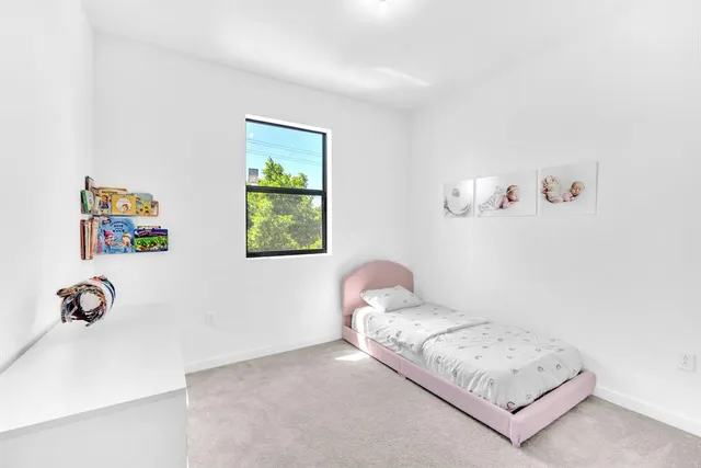 a view of walk in closet with clothes