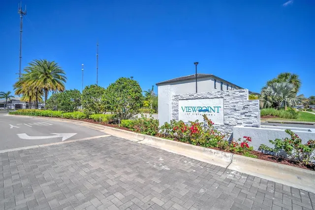 a house with palm tree in front of it