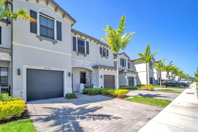 a view of front door of house with yard