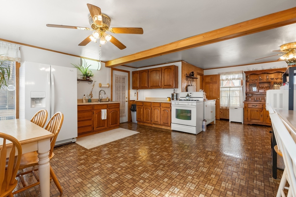 35 Lafayette Road Salisbury, MA 01952 - Photo 11 of 40 a kitchen with stainless steel appliances kitchen island granite countertop a sink and cabinets