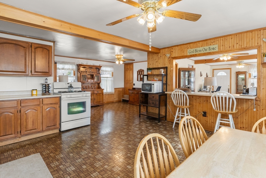 35 Lafayette Road Salisbury, MA 01952 - Photo 12 of 40 a view of a kitchen with dining table and chandelier