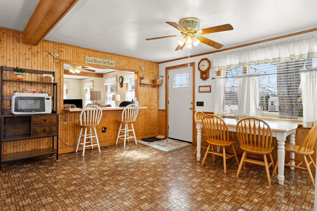 35 Lafayette Road Salisbury, MA 01952 - Photo 13 of 40 a dining room with furniture a flat screen tv and a large window