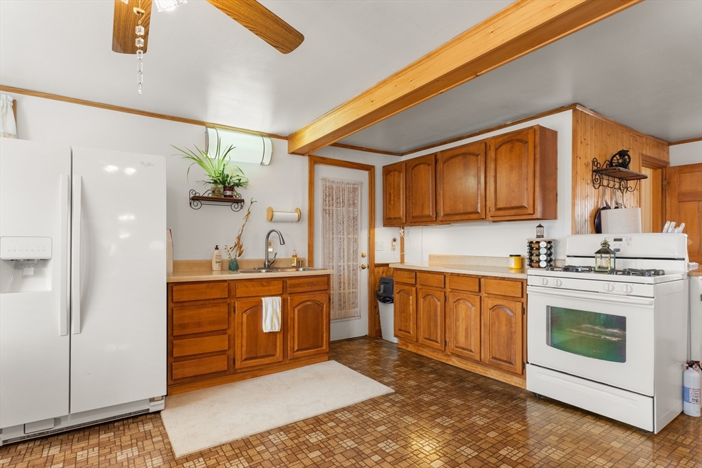 35 Lafayette Road Salisbury, MA 01952 - Photo 14 of 40 a kitchen with stainless steel appliances granite countertop a stove a sink and a refrigerator