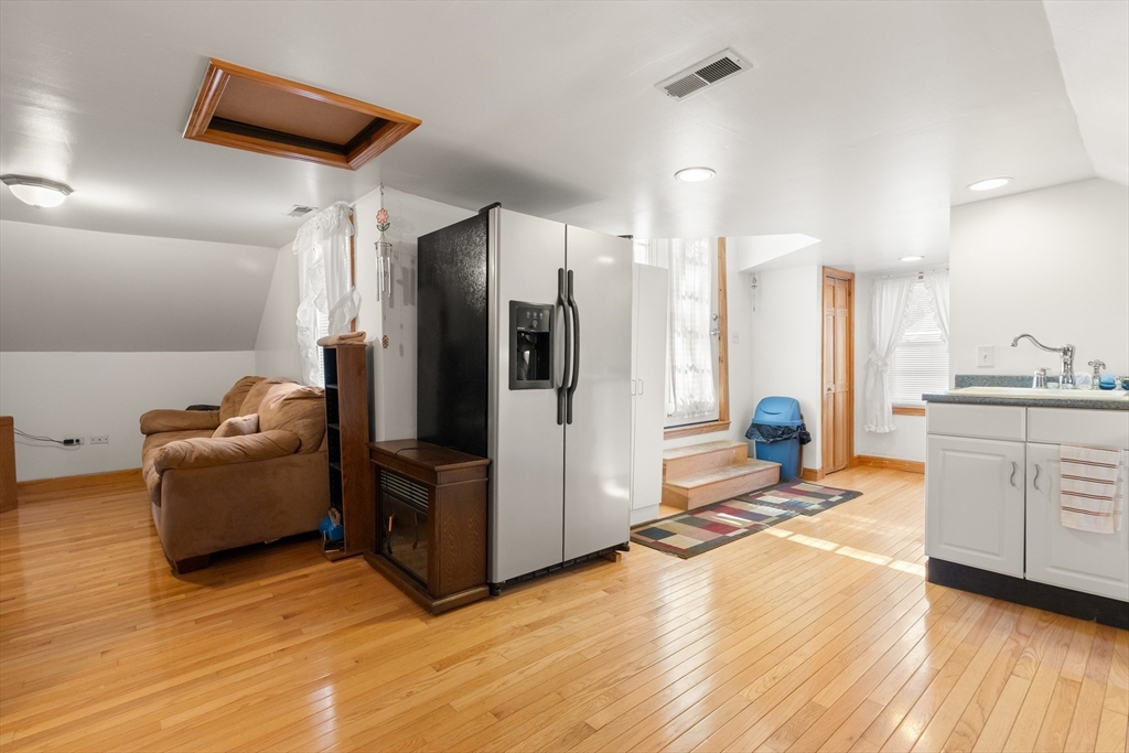 35 Lafayette Road Salisbury, MA 01952 - Photo 23 of 40 a kitchen with stainless steel appliances kitchen island granite countertop a refrigerator and a stove top oven