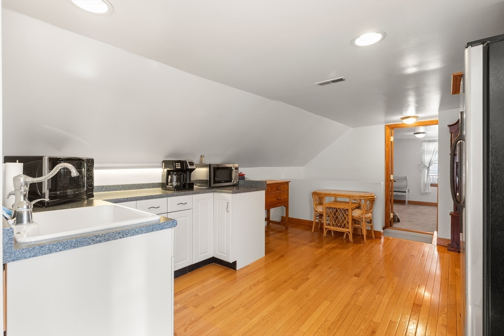 35 Lafayette Road Salisbury, MA 01952 - Photo 24 of 40 a kitchen with a sink and chairs