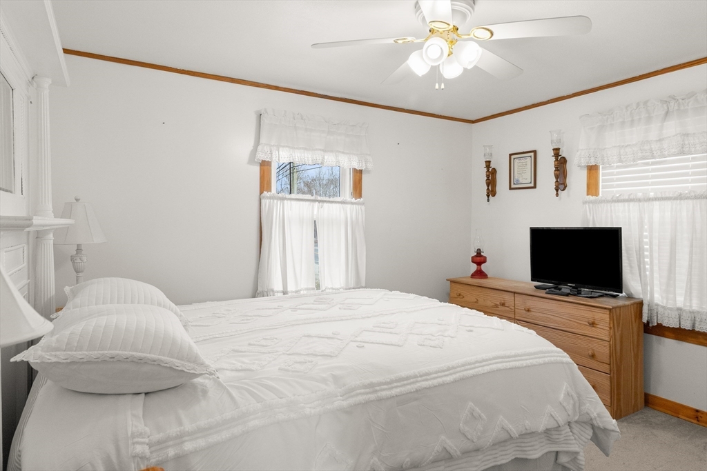 35 Lafayette Road Salisbury, MA 01952 - Photo 4 of 40 a bedroom with a bed and a flat screen tv