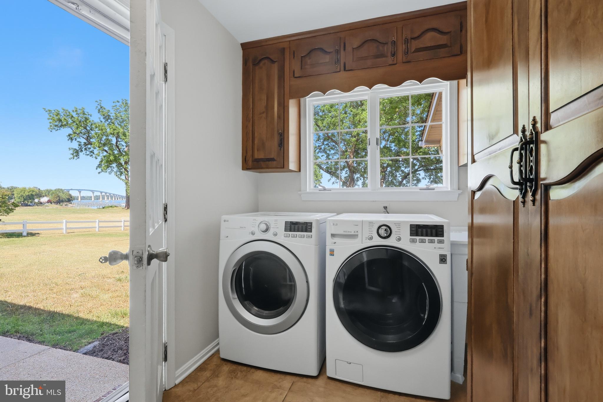 23500 River Road Lexington Park, MD 20653 - Photo 39 of 92 a view of a storage and utility room with a washer and dryer