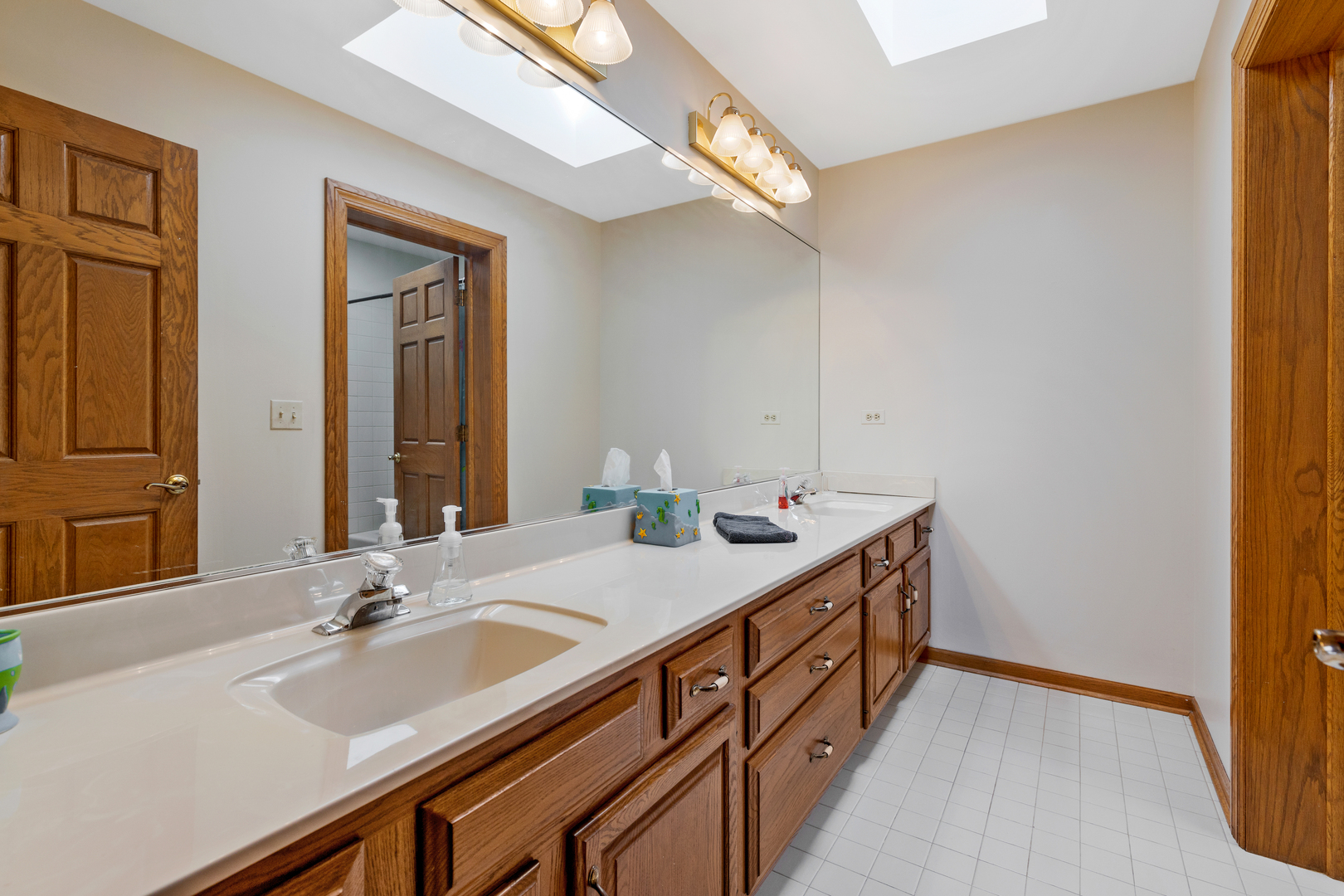 35W833 Parsons Road Dundee, IL 60102 - Photo 29 of 34 a bathroom with a sink and a mirror