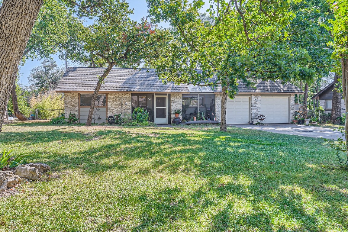 9206 Robins Nest Lane Austin, TX 78729 - Photo 1 of 18 a house view with a garden space