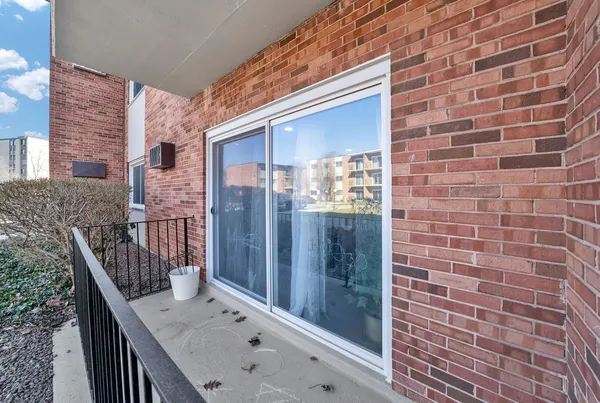 a view of balcony with wooden floor